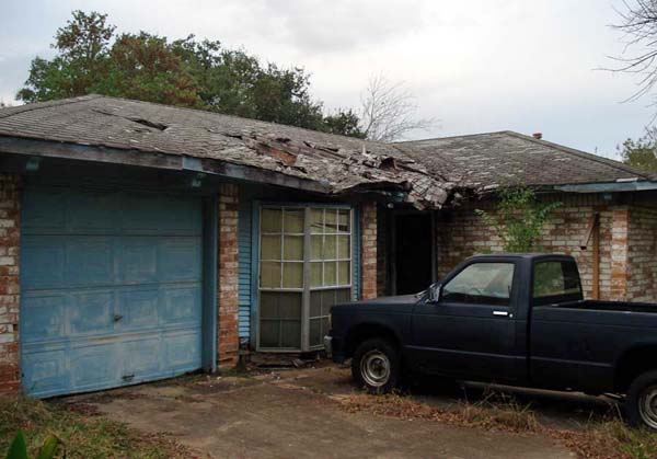 We buy houses in any condition including this Austin house with severe roof damage.
